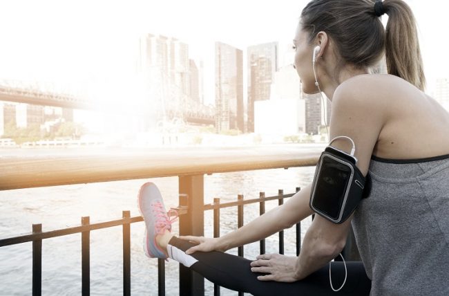 Fitness girl stretching after exercising How Often Should a 30-year-old Exercise